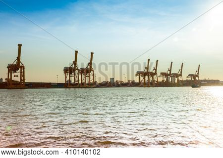 Shipping Crane Of Maritime Transportation Beside River