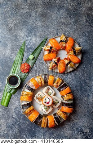 Sushi And Rolls Sets Japonese Food. Top View Gray Background
