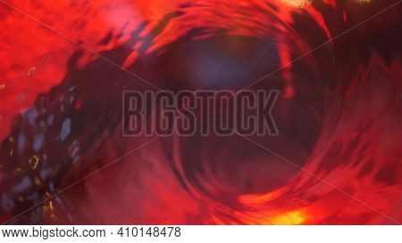Symbol Of Hell, Inferno And Infinity. Red Liquid Hypnotic Aqua Swirl Turning. Meditative Ruby Lumino