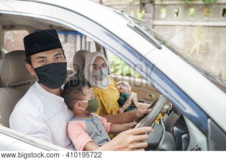 Muslim Family Wearing Face Mask During Travel By Car
