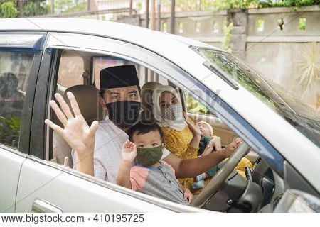 Muslim Family Wearing Face Mask During Travel By Car
