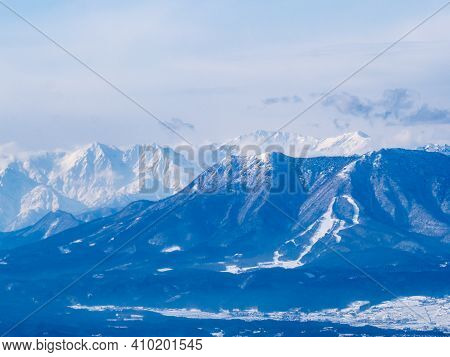 The Snow-covered Peaks Of The Japanese Alps As Viewed From Near The Summit Of The Shiga Kogen Ski Ar