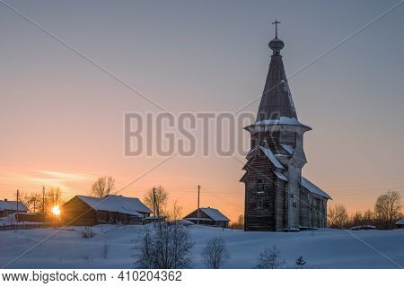Elias Church In Saminsky Churchyard Against The Backdrop Of February Sunset. Vologda Region, Russia