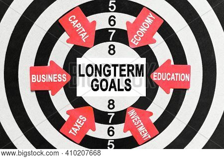 Business And Finance Concept. On The Target, Arrows With Business Lettering Point To The Center On A