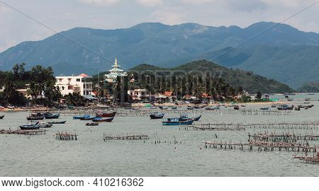 A Large Body Of Water With A Mountain In The Background