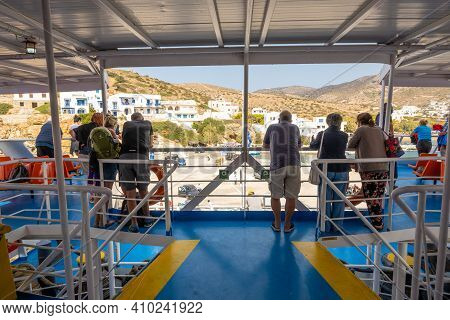 Sikinos, Greece - September 26, 2020: Tourists On Ferry. Coast Of Sikinos Island In Background. Gree
