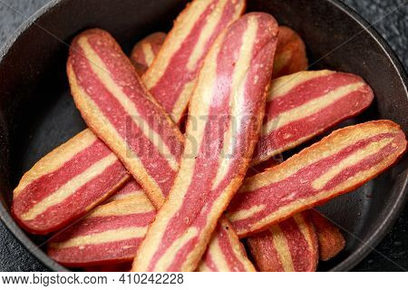 Fried Crunchy Plant Based Vegan Bacon Pieces In A Cast Iron Skillet