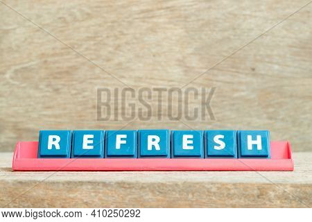 Tile Alphabet Letter With Word Refresh In Red Color Rack On Wood Background