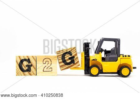 Toy Forklift Hold Letter Block G To Complete Word G2g (abbreviation Of Government To Government) On 