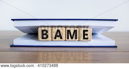 Bame Symbol. Abbreviation Bame, Black, Asian And Minority Ethnic On Wooden Cubes In Book. Beautiful 
