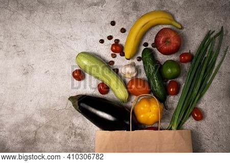Healthy Lifestyle And Food Concept. Vegetables And Fruits Falling Out From Paper Pocket, Cucumber, T