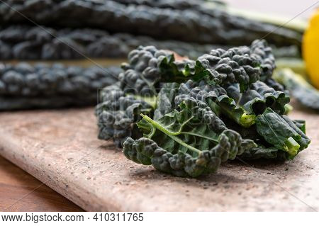Cooking With Black Flat Leaves Of Cavolo Nero Tuscan Cabbage
