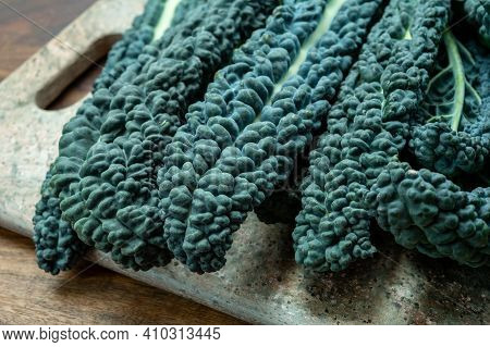 Cooking With Black Flat Leaves Of Cavolo Nero Tuscan Cabbage