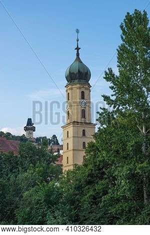 Mur River, The Franciscan Church Tower And The Famous Clock Tower (grazer Uhrturm) In The Background