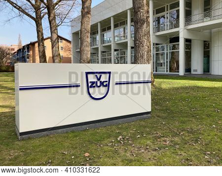 Zug, Switzerland - 26th February 2021 : V-zug Ag Company Sign In Front Of The Zugorama Building In Z