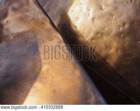 Metal Bronze Textured Plate. Bronze Or Copper Polished Surface With Dents, Scratches And Indentation