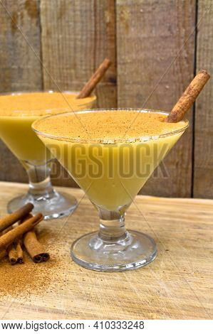 Boza And Cinnamon Sticks, Traditional Turkish Cuisine Drinks, On Wooden Bamboo Background