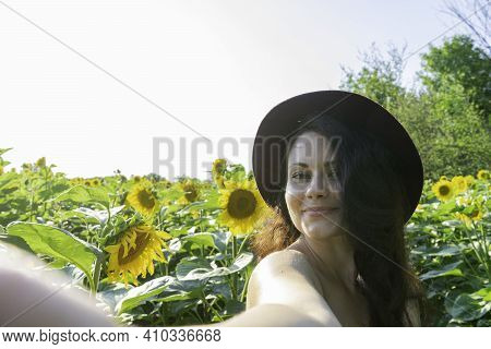 Cute Woman With Sensuality Taking Selfie With Smart Phone On Sunflower Field. Caucasian Lady With Fa