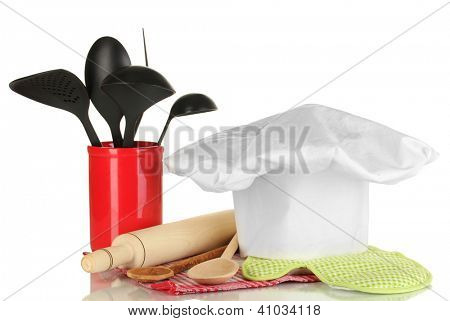 Kochmütze mit Löffel und Federballschläger, isolated on white