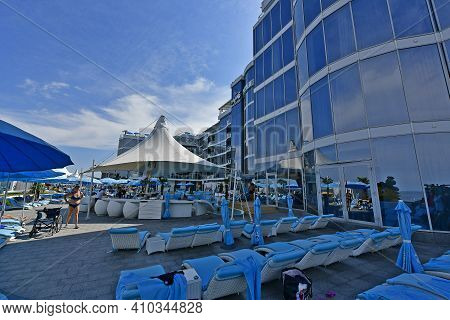 Ukraine, Odessa 07/27/2020. Lanzheron Beach. A Picturesque Embankment With Palm Trees, Fountains, Ge