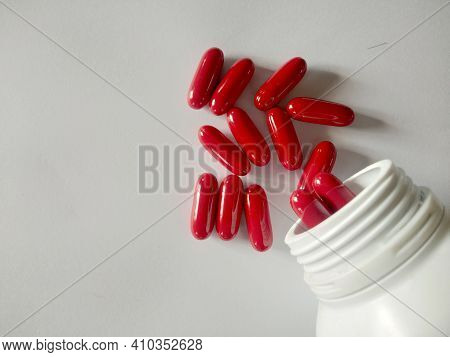 Red Pills, Red Vitamins, Red Pills On A Warm White Background, Look Clean. Vit B.