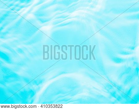 Ripple Water Texture On Blue Pool Background. Shadow Of Water On Sunlight. Mockup For Product, Spa O