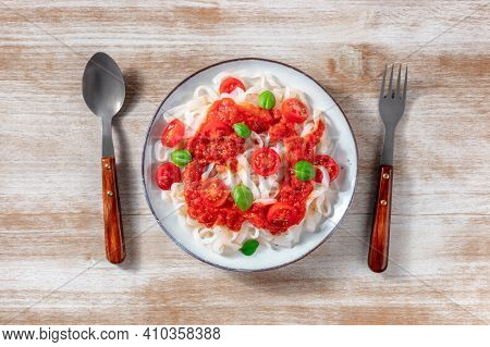 Konjac Pasta With Tomato Sauce And Basil, Shot From The Top On A Wooden Background