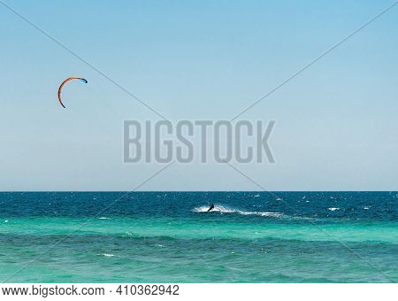 Extreme Water Sport - Kitesurfing At Sea On Hot Summer Sunny Day Copy Space. The Concept Of An Activ