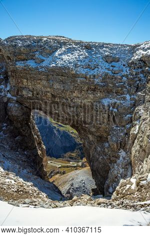 Arch in the Alps. The Pordoi Pass is part of the Dolomiti Superski ski resort. Dolomites in the snow.  South Tyrol. Italy. 