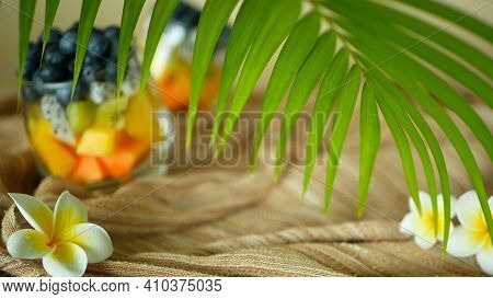 Colorful Tropical Mix Salad In Jar. Fresh Various Kind Of Raw Organic Berry And Fruit In Glass Bowl.