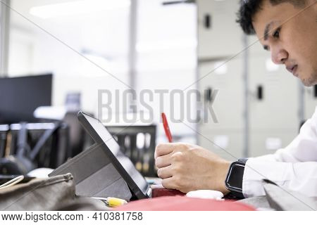 Asian Education Man Reading Books So Looking Tablet In Office To Prepare For The Exam Entrance To Le