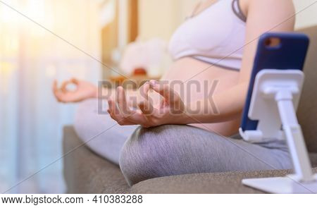 Pregnant Woman Stay At Home Alone. Prefnancy Onlinelearning For Yoga And Workout. Healthy And Wellne