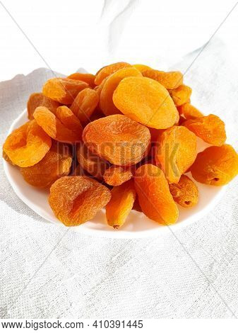 Dried Apricots On White Plate