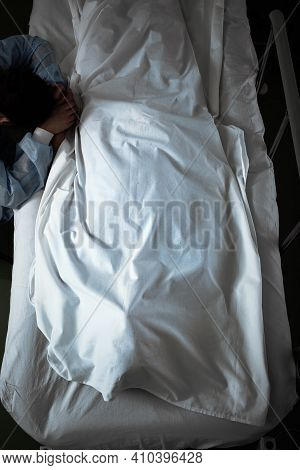 Female Visitor Mourning Over Dead Patient In The Hospital.