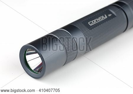 Lviv, Ukraine - February 24, 2021: Convoy S2+ Flashlight Close-up
