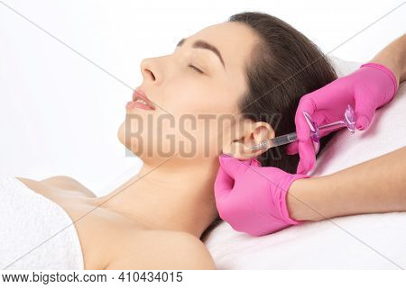 The Doctor Cosmetologist Makes The Injections Procedure For Smoothing Wrinkles And Against Flabbines
