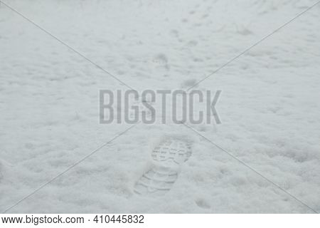 Bootprints In Snow Outdoors On Winter Day