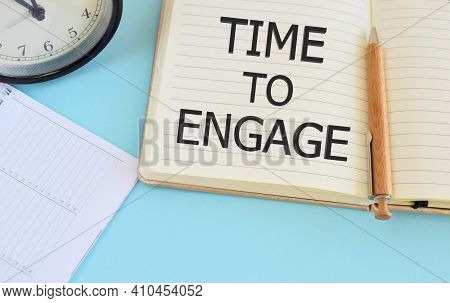 Time To Engage Text Written In Notebook. Lightblue Background. Business Concept For Engagement Invol