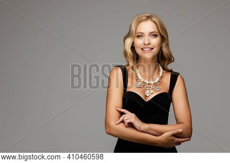Mirthful Lady In The Evening Outlook Posing And Smiling