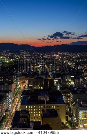 Cityscape Colorful Night View Against Cloudy Sky At Day Time