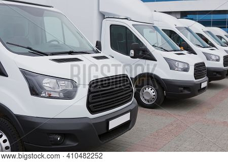 Number Of New White Minibuses And Vans Outside