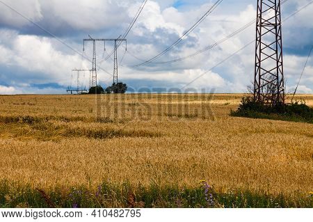In The Background Is A Sky With Dramatic Clouds.