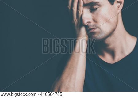 Young man suffering from anxiety, depression due to social seclusion, isolation, COVID induced lockdown