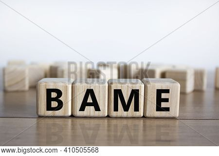Bame Symbol. Abbreviation Bame, Black, Asian And Minority Ethnic On Wooden Cubes. Beautiful Wooden T