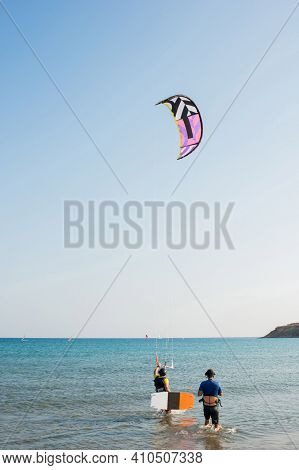 Two People Practising Kytesurf At Prasonisi Beach, Rhodes, Dodecanese, Greece. Sunny Day.
