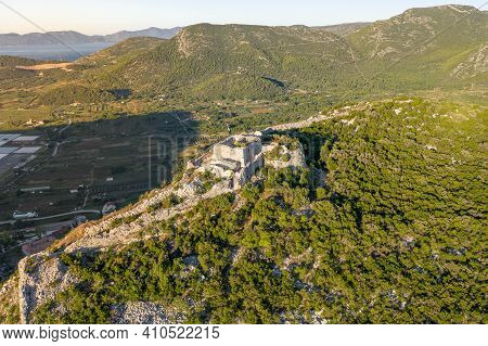 Aerial Drone Shot Of Fortress Of City Of Ston On Top Of Hill In Ragusa Near Dubrovnik In Croatia Sun
