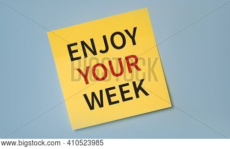 Enjoy Your Week Written On Yellow Stocker Against Blue Background.happiness And Relax Concept. Happi