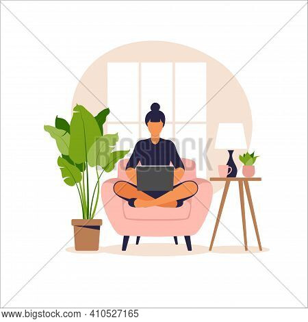 Woman Sitting On Sofa With Laptop. Working On A Computer. Freelance, Online Education Or Social Medi