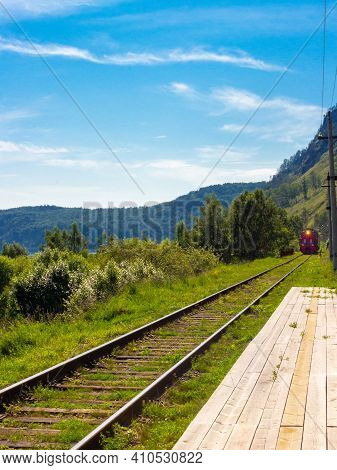 Arrival Of The Train On The Platform Of The Trans Siberian Railway. Circum-baikal Railway On The Coa