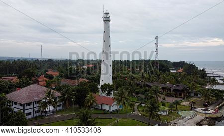 Aerial View Of Lighthouse Sea Rock Sunset Landscape. Sunset Lighthouse Scene. At Anyer Beach With No